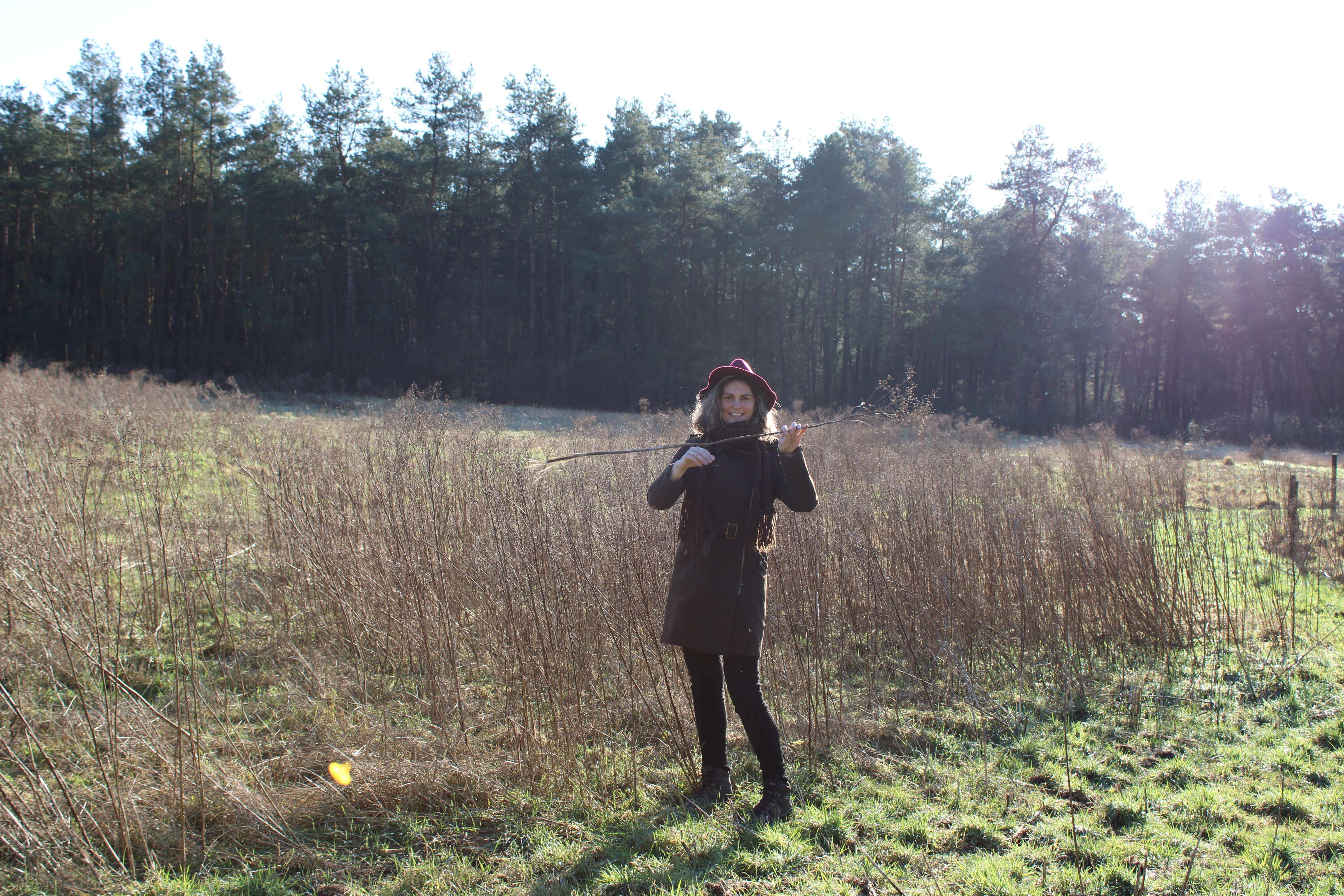 Gabrielle plays outside in forest